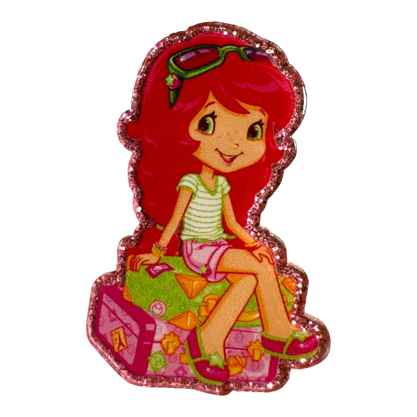 New Strawberry Sitting On Luggage